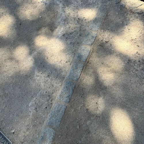 division of concrete and gravel path with stone bricks division of concrete and gravel path with stone bricks