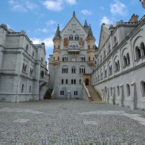Neuschwanstein courtyard balcony with cobblestone paving