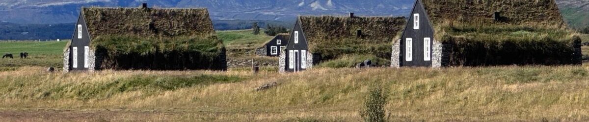 Traditional turf-roofed houses in the Icelandic countryside
